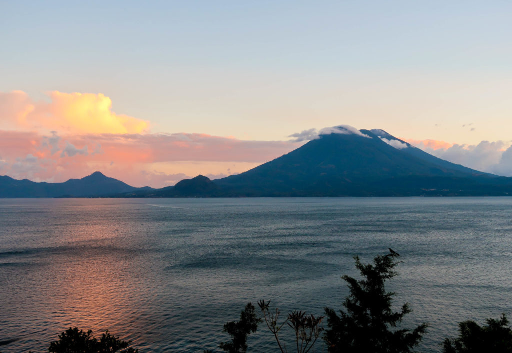 volcano at lake atitlan at sunrise