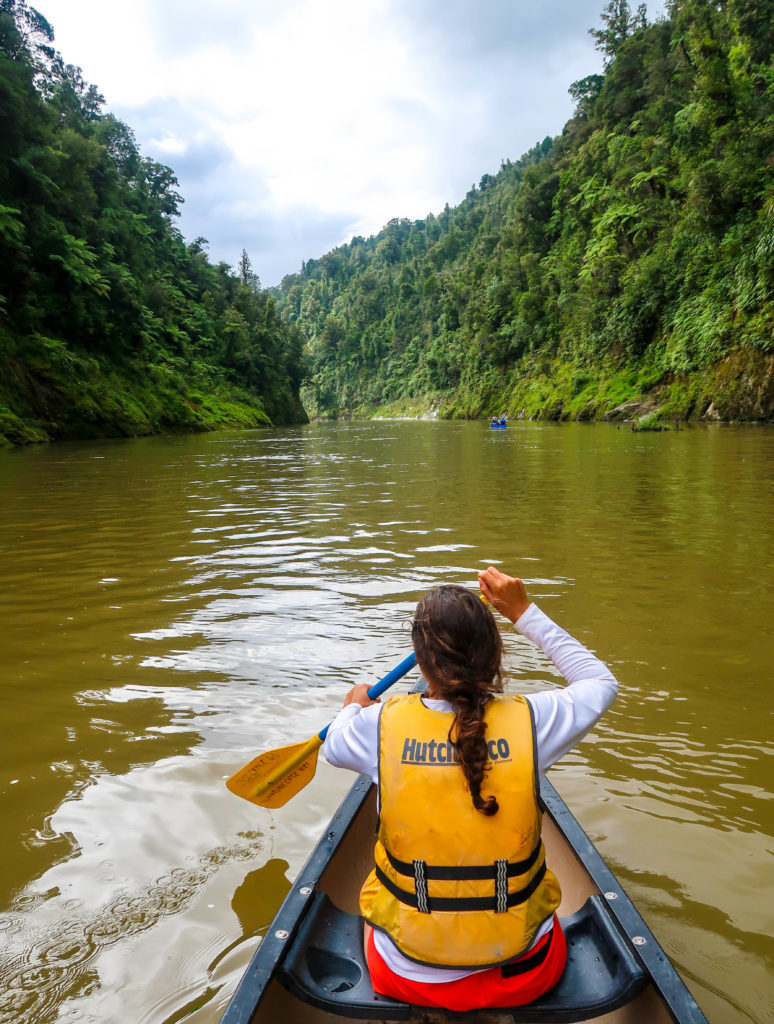 Maddy rowing a canoe during her Whanganui River Journey