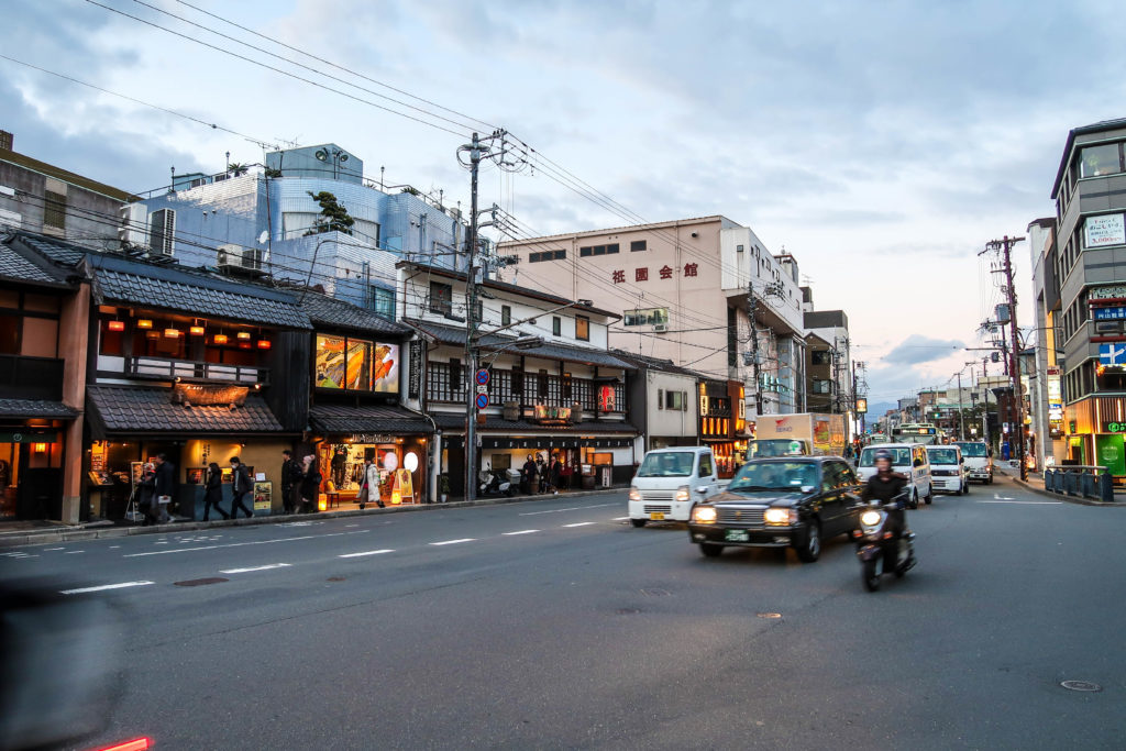 Vehicles on a road in Kyoto, Japan at dusk