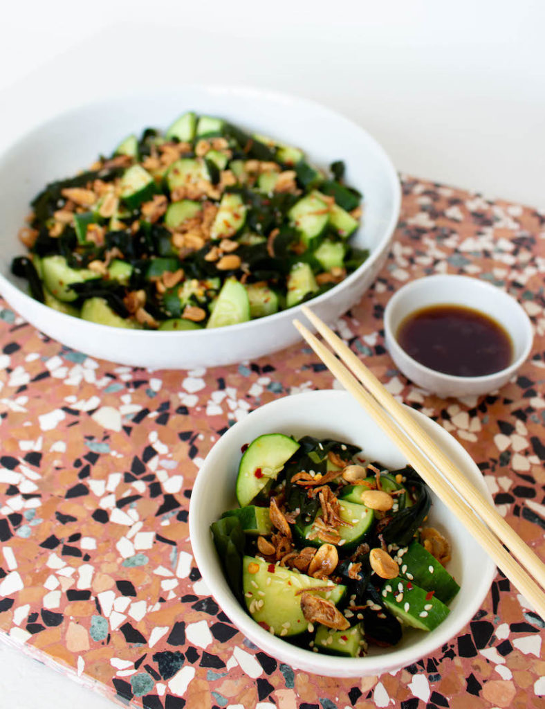 Asian cucumber salad with wakame seaweed, peanuts, sesame seeds, and chili. It's a mix of a Thai cucumber salad and a Japanese cucumber salad. Ready in 10 minutes and so delicious!