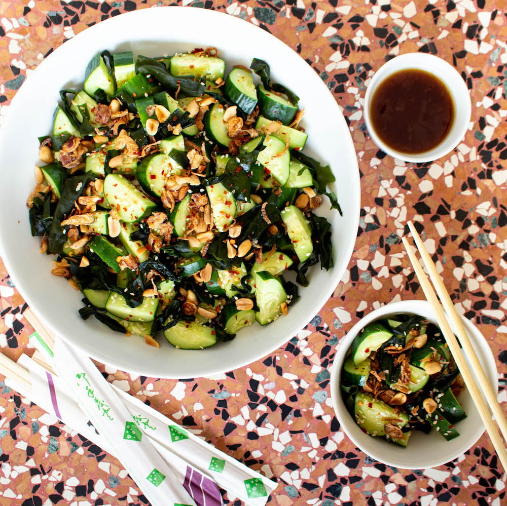 Asian cucumber salad with wakame seaweed, peanuts, sesame seeds, and chili. Ready in 10 minutes!