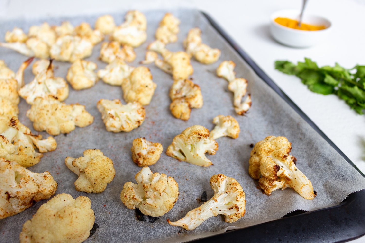 Roasted cauliflower florets on a tray