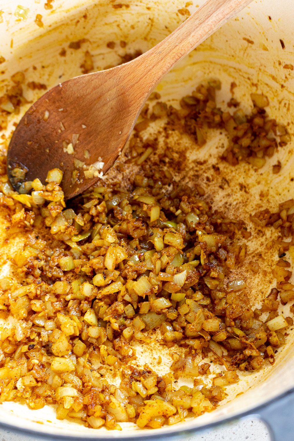 garlic, onion, and ginger sauteing with spices