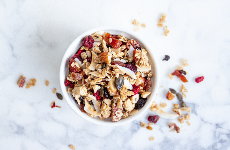 This is the best homemade granola recipe. It's healthy and easy, and loaded with oats, nuts, seeds, fruit, and coated in maple, vanilla, cinnamon, and coconut oil. Crunchy, chewy, sweet, salty, and so addictive, you're going to love this breakfast treat!