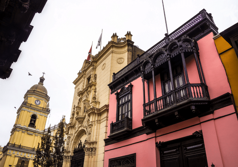 Pink colonial building and government buildings in Lima, Peru