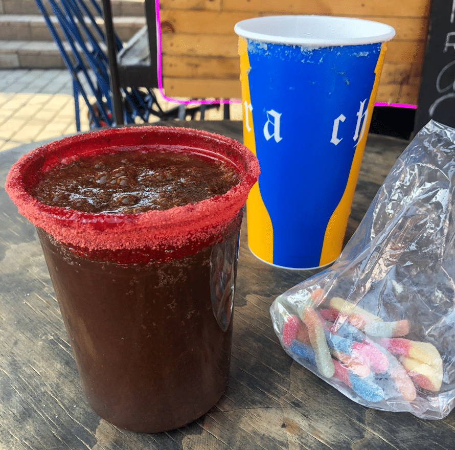 Michelada with chamoy rim and gummy worms