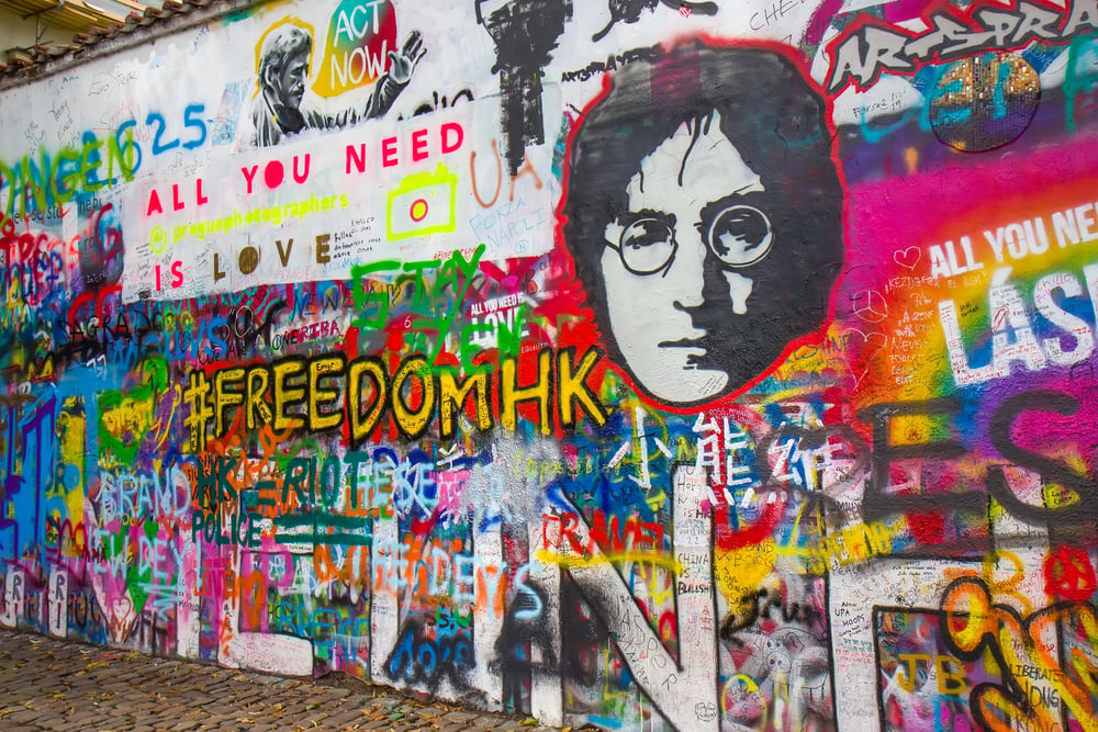 Colorful street art on the John Lennon Wall, a must-add to your Prague 3-day itinerary