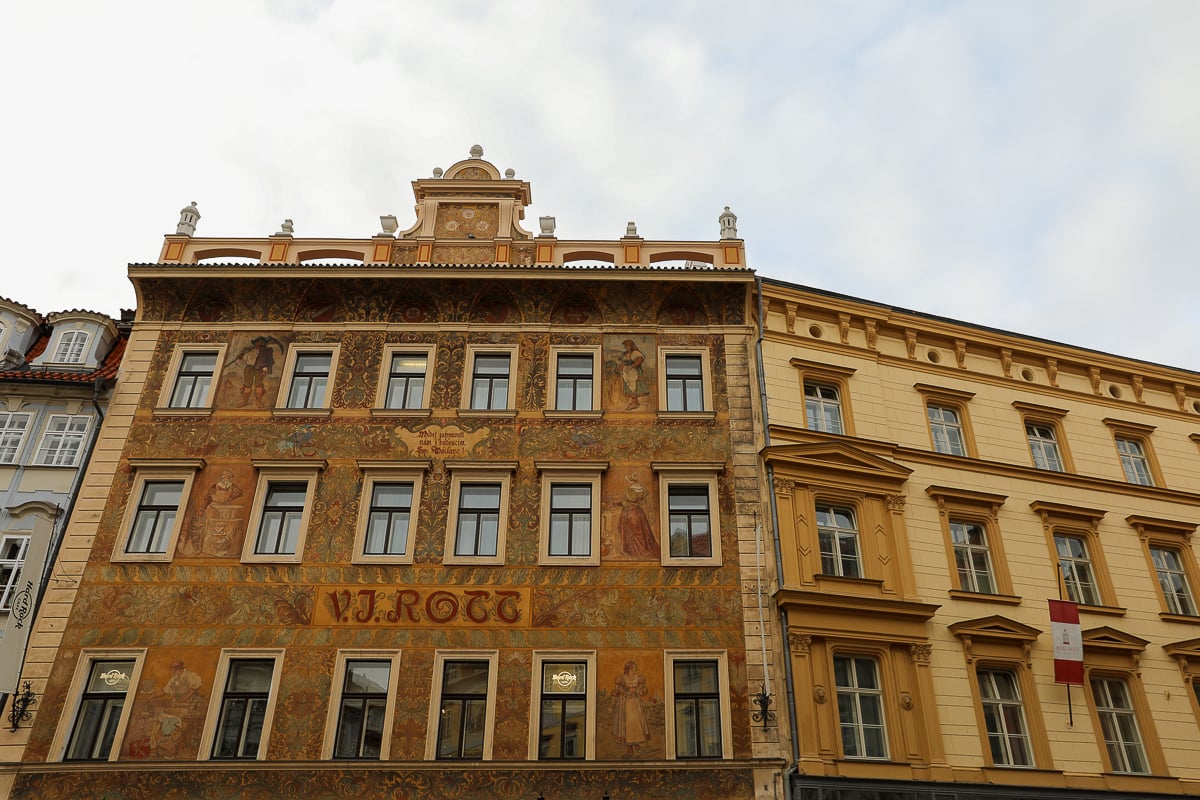Historic façade of Hotel Rott in Prague’s Old Town, decorated with colorful Renaissance-style murals and ornate architectural details.