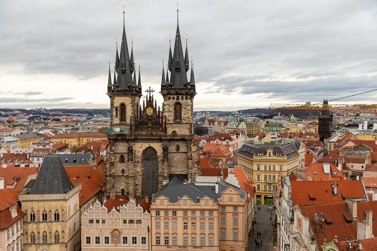 A view of the beautiful buildings and a Gothic church in the Old Town Square of Prague, as seen from the Old Town Hall Tower