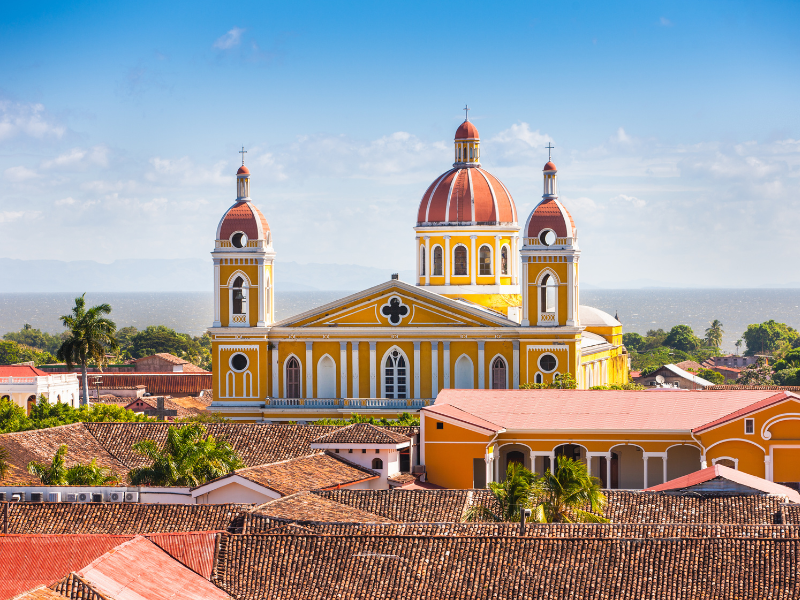 View of the beautiful city of Granada and lake Nicaragua in the background - seeing the colonial cities is one of the top reasons to visit Nicaragua