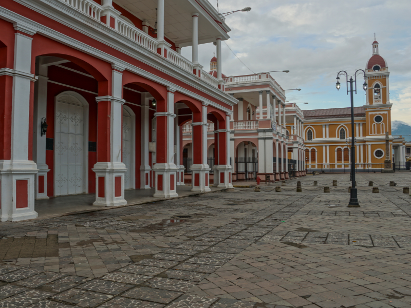 View of a colorful street in Granada, Nicaragua - seeing this city is one of the top reasons to visit Nicaragua