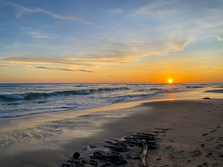 Sunset and beach waves in Playa Negra