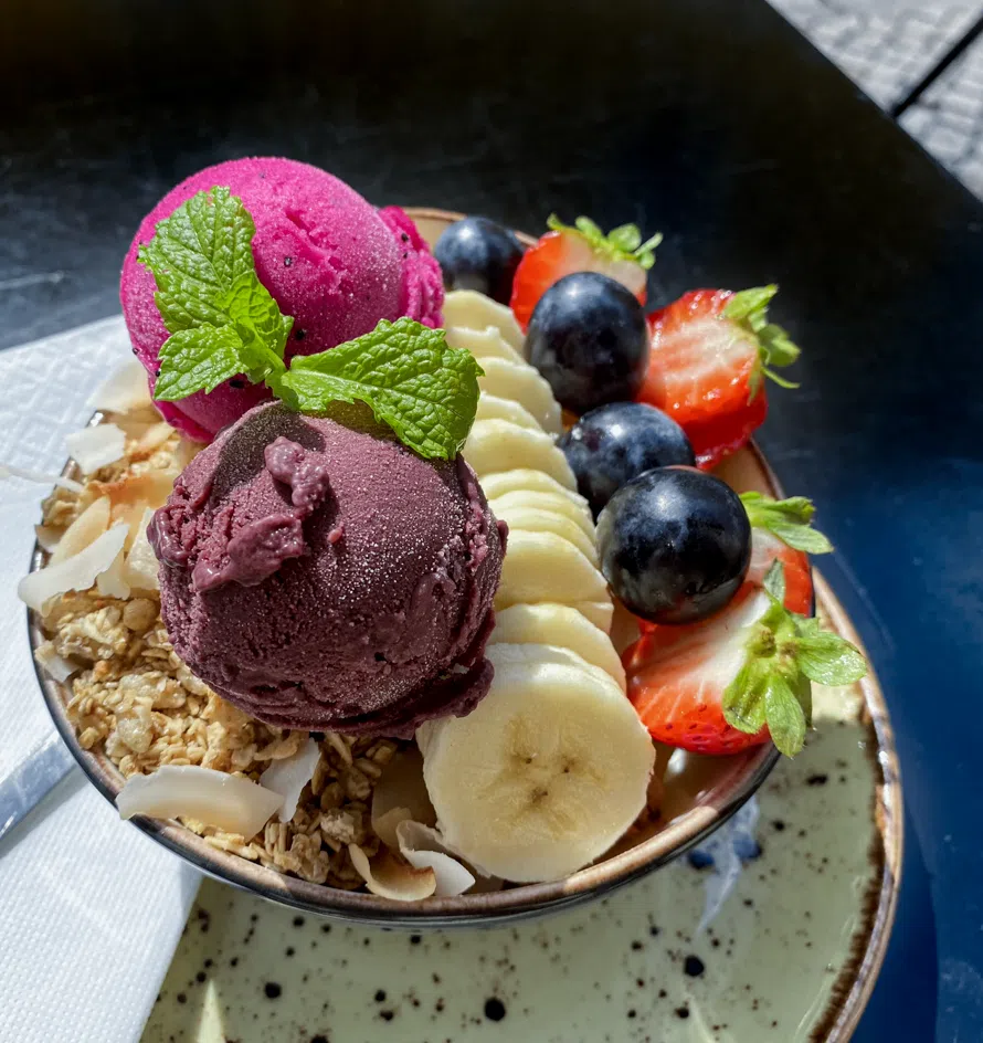 A beautiful acai and fruit bowl at a cafe in Lisboa - a must-eat during 3 days in Lisbon. This Lisbon Itinerary includes all of the best things to do, see, and eat!