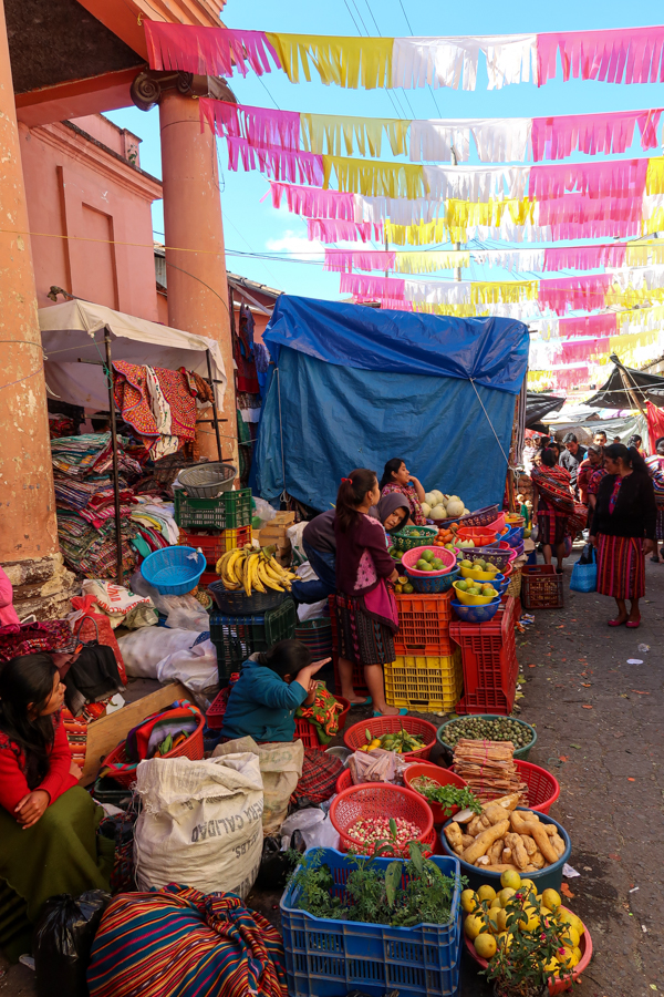 Women selling veggies at a market in Guatemala