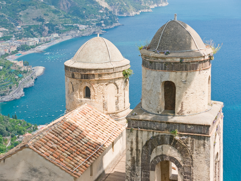 The famous view of the Chiesa Dell'Annunziata with the sparkling sea in the background. This church is a must-see in Ravello, Italy. 