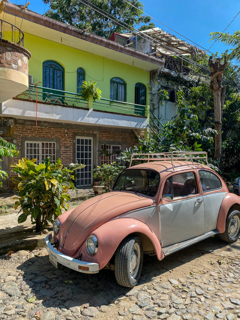 Colorful houses and a car in Mexico