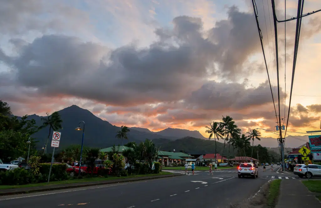 Sunset in Hanalei as seen from the road where people and cars move along. You'll surely see lots of lovely sunsets during your Kauai vacation.