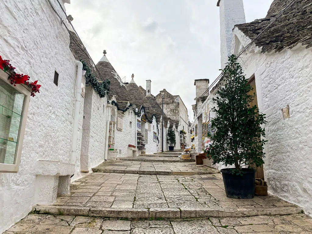 A quiet and cute street - one of the best things to do in Alberobello, Italy is to simply wander the charming streets and enjoy the veiws