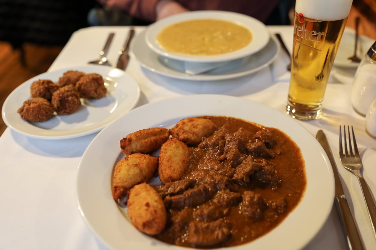 Plate of beef goulash and other Hungarian dishes at Café Kör in Budapest