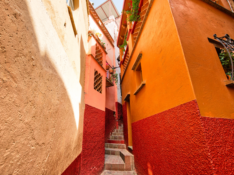 The colorful and narrow alleyway of Callejon del Beso with steps leading up