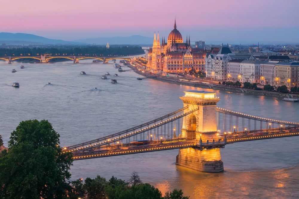 View of The Chain Bridge and House of Parliament from afar. Don't forget to stop by these landmarks when you visit Budapest in 3 days.