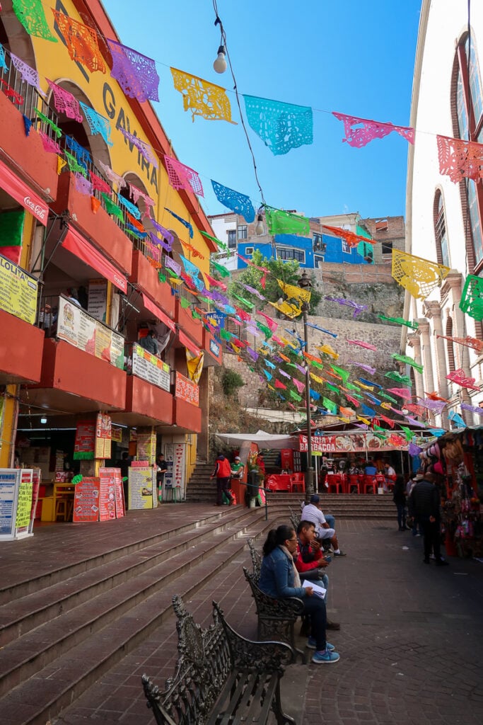 People sitting outside of Mercado Hidalgo