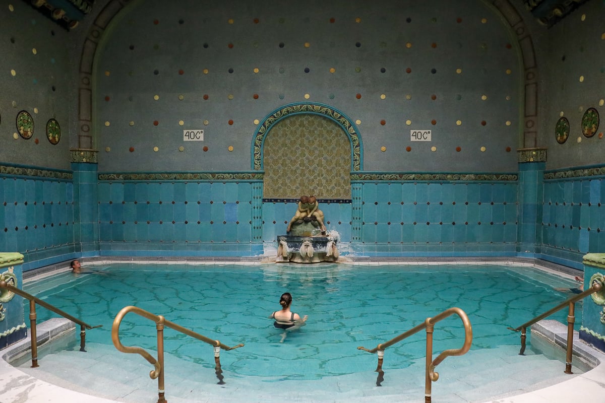 Maddy soaking at Gellért Thermal Bath with no one other tourists around