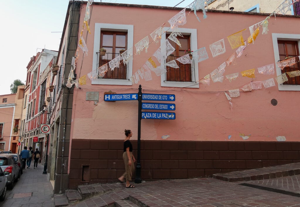 Maddy walking down a street in Guanajuato