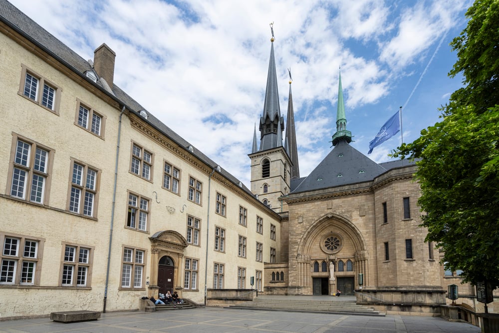 Notre Dame Cathedral in Luxembourg with cloudy skies behind