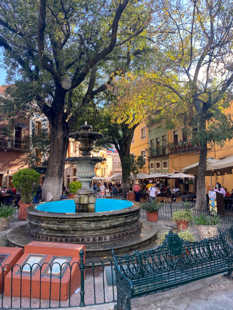A fountain and trees in a lovely plaza