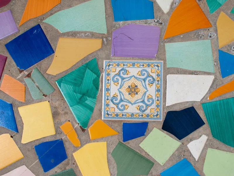 Colorful ceramic tiles on cement ground