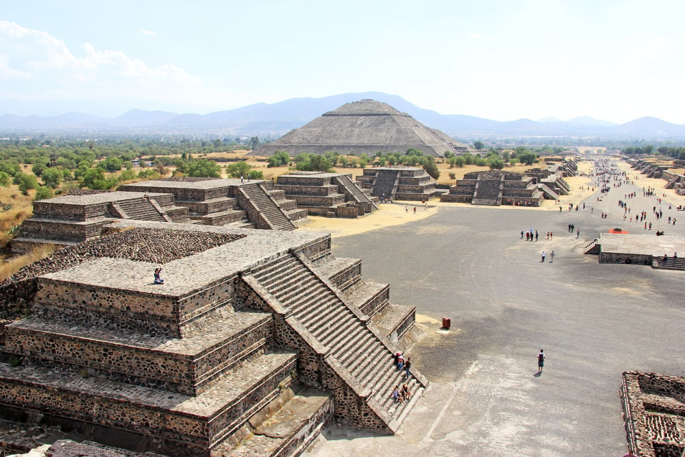 Pyramids in Teotihuacan with people walking around, exploring