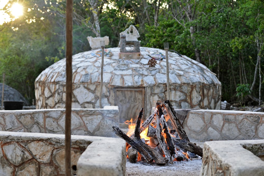 Temazcal ceremony hutt with a fire in front