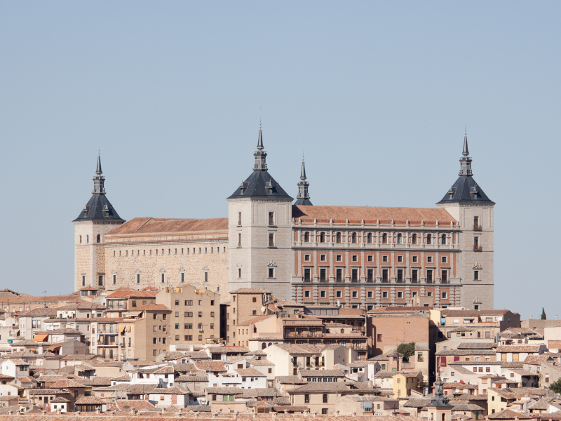 View of Alcazar of Toledo and its surrounding buildings during daytime