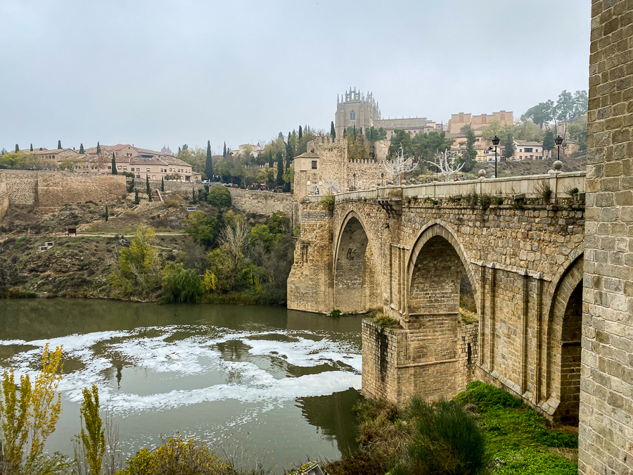 View on the other side of a historical bridge in Toledo, Spain