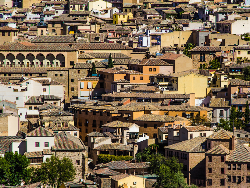 Overlooking historical buildings and houses in Toledo, Spain on a sunny day