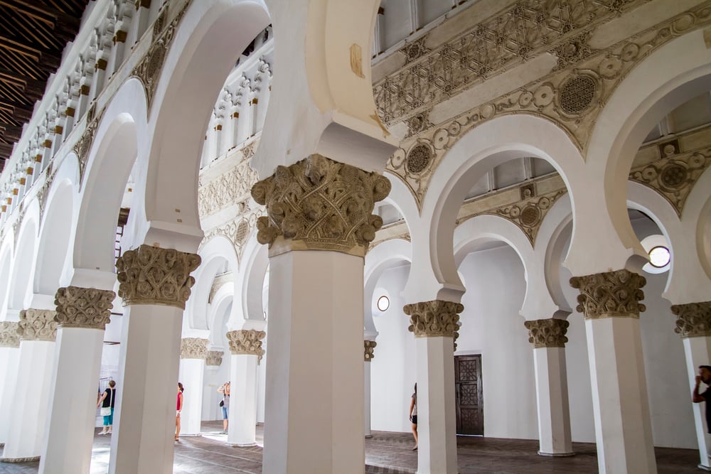 Inside the Toledo Synagogue showing the detailed arches and paneling