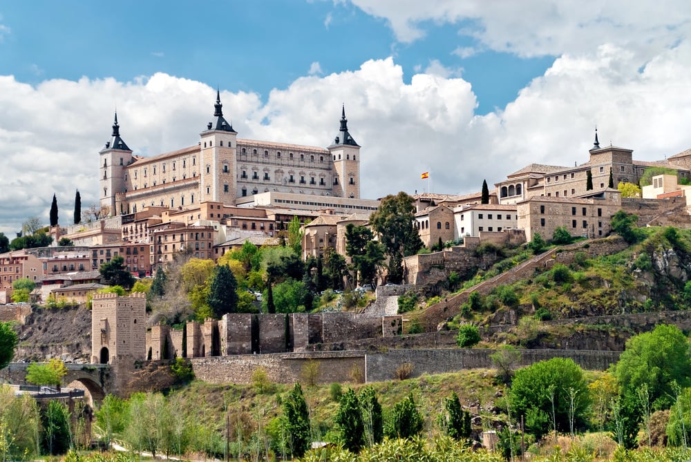 View of Alcazar of Toledo and its surrounding buildings during daytime