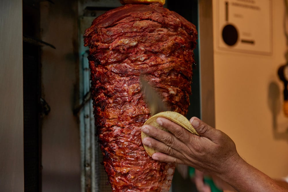 Al pastor tacos being prepared