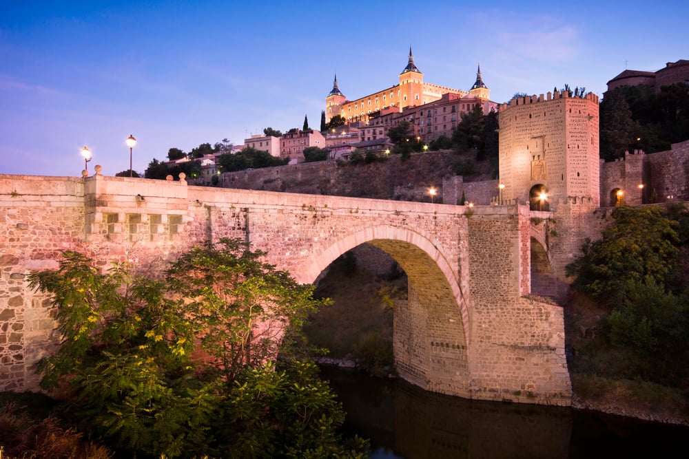 The Alcazar and medieval San Martin Bridge at sunset