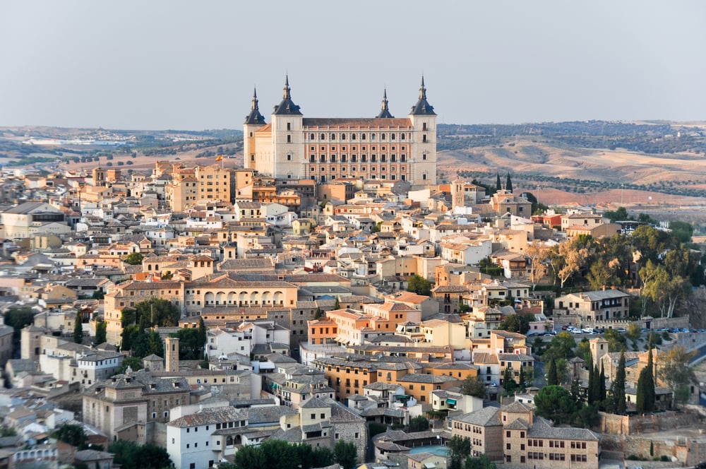 Panoramic view of historical buildings in Toledo, an old town in Spain with a hazy, grey sky