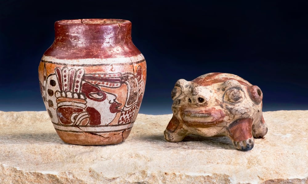 Ancient vase and frog ornament in the National Museum of Anthropology. Visiting museums is one of the best things to do in Mexico City.