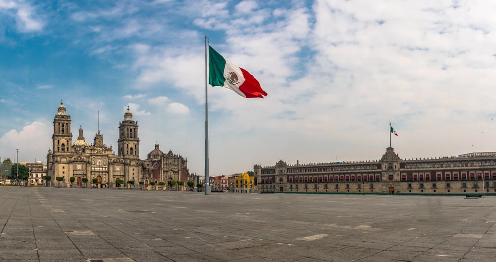 The Zocalo in Mexico City with the Mexican flag waving in the wind