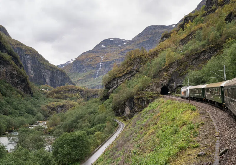 Traveling on the Flam Railway through dramatic mountain scenes in Norway