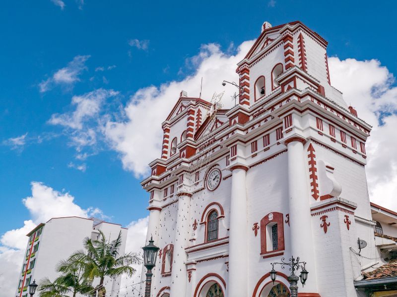 Iglesia de Nuestra Señora del Carmen - a colonial church in Colombia. Wandering around the vibrant buildings and monuments is one of the best things to do in Guatape.