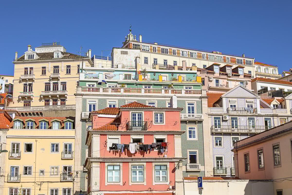 Tall, colorful houses in Alfama, Lisbon on a sunny day