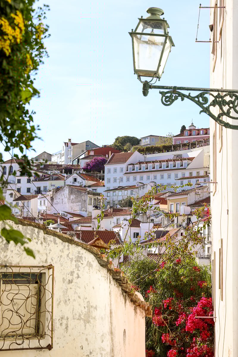 View of Lisbon's colorful buildings as seen from an alleyway
