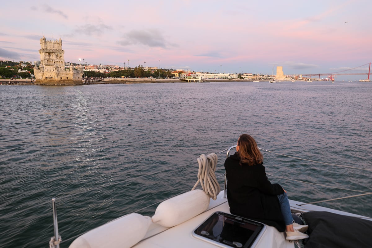 Maddy on a boat sailing along the Tagus river at sunset