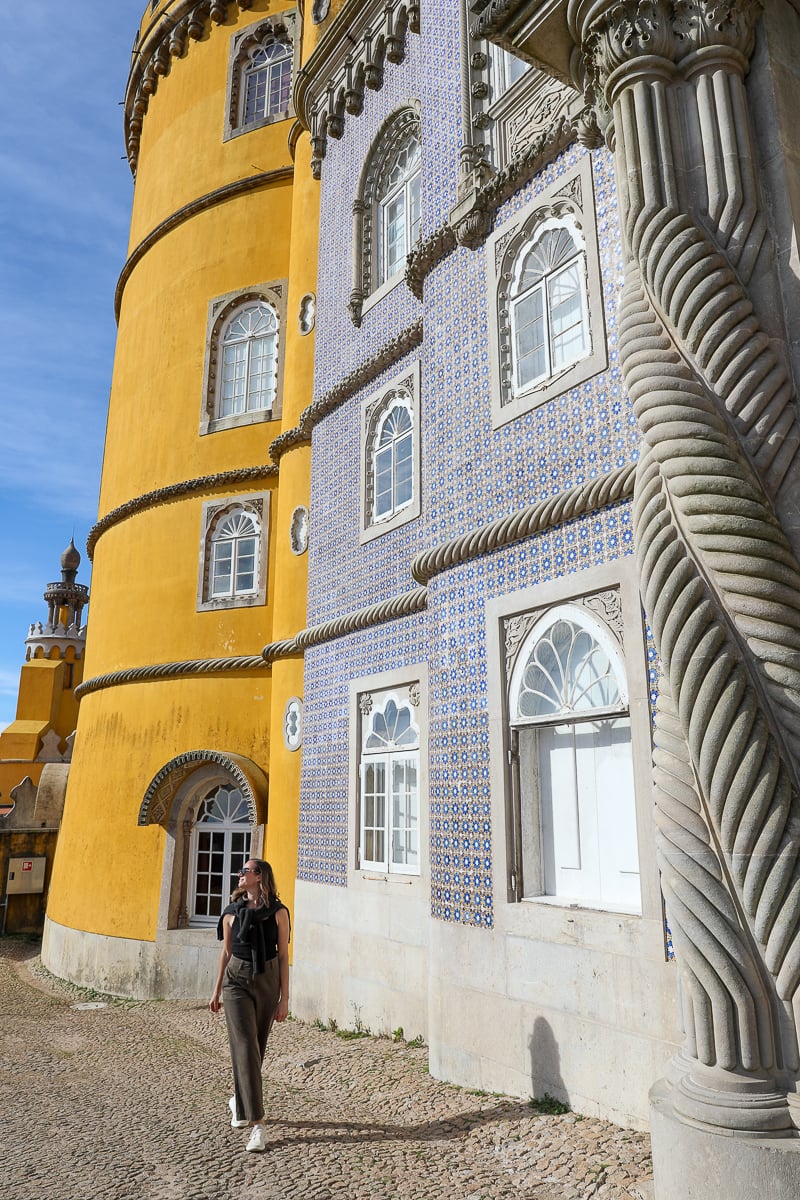 Maddy walking around Pena Palace on a sunny day