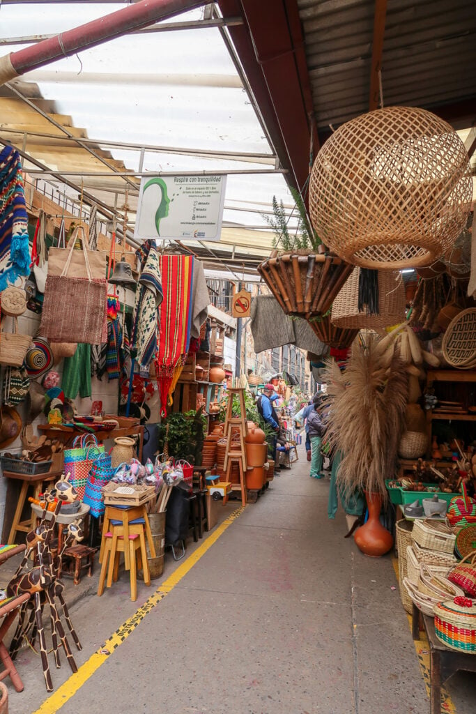 Shops of handmade goods in La Candelaria. Exploring this neighborhood is one of the cheap things to do in Bogota, Colombia.